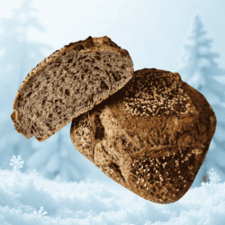 Pain de campagne cuit sur pierre, parsemé de graines de sésame noir et blanc, croûte croustillante et mie souple